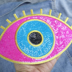 large sequined evil pink eye patch, blue eyeball, iron on patch, stick on patch, embroidered patch, funny patch, aesthetic patch