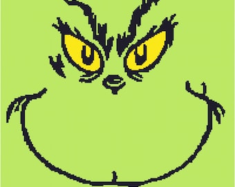 May include: A green cartoon face with black eyebrows, eyelashes, and a wide mouth. The face has two yellow eyes with black pupils.