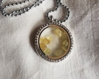 Peridot in Victorian glass locket.