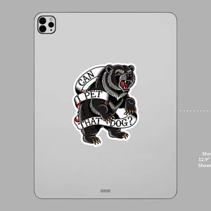 May include: A black bear tattoo sticker with the text "CAN I PET THAT DOG?" on a white banner. The bear is snarling, with red accents on its mouth and claws. The sticker is displayed on a tablet.
