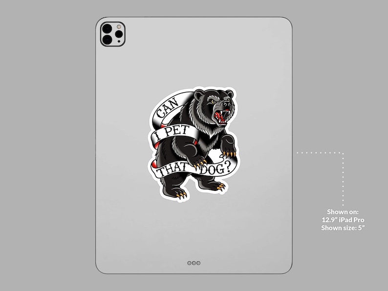 May include: A black bear tattoo sticker with the text "CAN I PET THAT DOG?" on a white banner. The bear is snarling, with red accents on its mouth and claws. The sticker is displayed on a tablet.