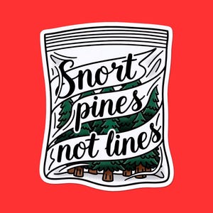 May include: A sticker with a red background featuring a white outline of a bag with the words "Snort pines not lines" in black script. Inside the bag are green pine trees.