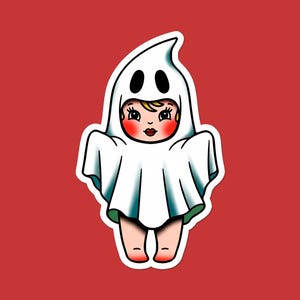 May include: A sticker featuring a cartoon illustration of a child dressed as a ghost. The child is wearing a white sheet with two black eye holes and a pointed top. The background is a solid red.
