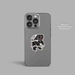 May include: A sticker featuring a black bear with a red tongue and the text "CAN I PET THAT DOG?" on a banner. The sticker is shown on an iPhone 13 Pro Max, with a size of 2 inches.