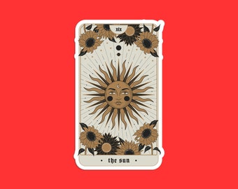 May include: A tarot card with a gold sun with a face and rays, surrounded by sunflowers. The card is labeled "XIX. the sun."