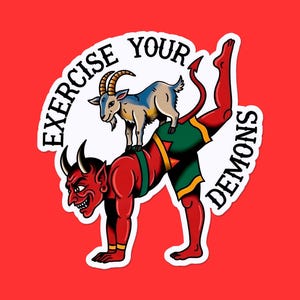 May include: A sticker with a red background featuring a cartoon devil in green shorts with a goat on its back. The text "EXERCISE YOUR DEMONS" is in a white circle around the figures.