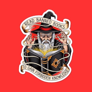 May include: A sticker featuring a wizard in a black hat and robe, holding an open book with glowing pages. The banner reads "READ BANNED BOOKS" and "TO GAIN FORBIDDEN KNOWLEDGE" on a red background.