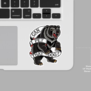 May include: A black bear sticker with the text "CAN I PET THAT DOG?" on a white banner. The bear is snarling, with its mouth open, and is on a laptop. The sticker is approximately 3 inches in size.