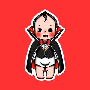 May include: A cartoon illustration of a baby dressed as a vampire, set against a red background. The baby wears a black cape with a red lining, a black vest, a red bow tie, and has fangs. The baby is wearing a white diaper.