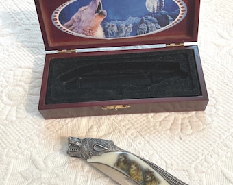 vintage pocket knife: engraved wolf folding knife