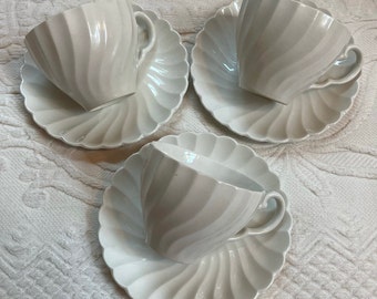 ironstone tea cups and saucers . Snowhite Regency . Johnson Bros. ironstone tea cups . lot of 3