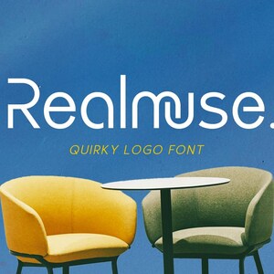 May include: The image features the text "Realmuse" in a white, quirky font, with the tagline "Quirky Logo Font." Two chairs, one yellow and one green, flank a small white table against a blue background.