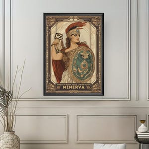 May include: A framed art print featuring a vintage illustration of Minerva, the Roman goddess of wisdom, holding a shield and an owl. The artwork has a sepia tone with red, gold, and green accents. The text "Goddess of Wisdom, Justice, Law and Victory" and "Minerva" are at the bottom.