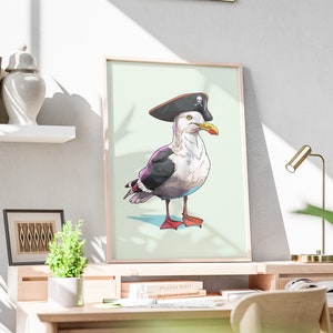 May include: A framed illustration of a seagull wearing a pirate hat with a skull and crossbones design. The seagull is standing on a light green background.