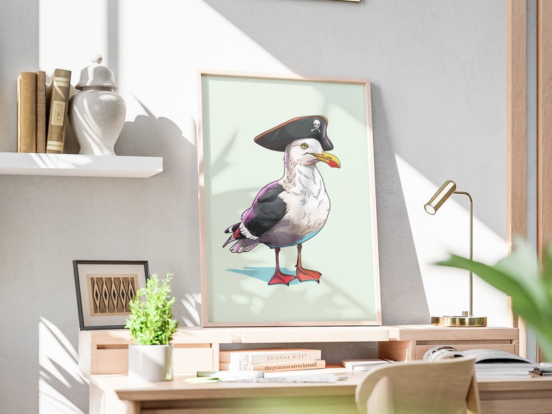 May include: A framed illustration of a seagull wearing a pirate hat with a skull and crossbones design. The seagull is standing on a light green background.