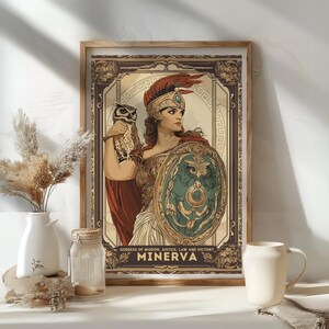 May include: Framed art print featuring Minerva, the Roman goddess of wisdom, justice, law, and victory. The artwork depicts Minerva with an owl and shield, in shades of brown, red, and green. The text "Goddess of Wisdom, Justice, Law and Victory" and "Minerva" are visible.