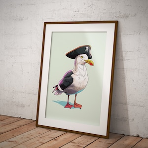 May include: A framed illustration of a seagull wearing a black pirate hat with a skull and crossbones design. The seagull is facing to the right and has a light gray body with black wings and a red beak.