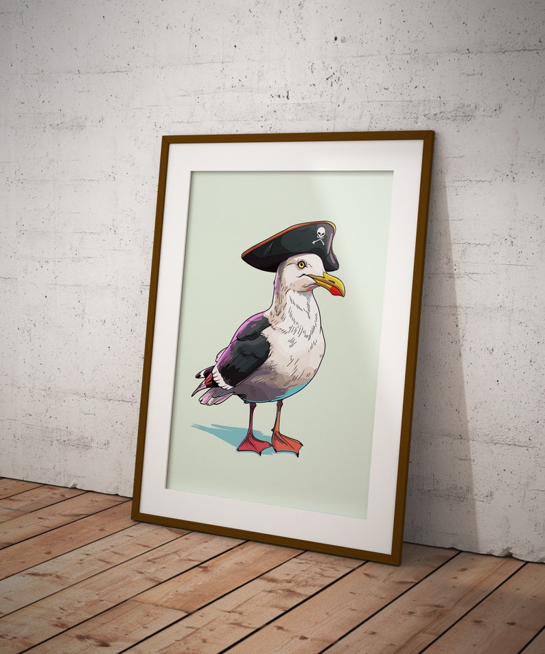 May include: A framed illustration of a seagull wearing a black pirate hat with a skull and crossbones design. The seagull is facing to the right and has a light gray body with black wings and a red beak.