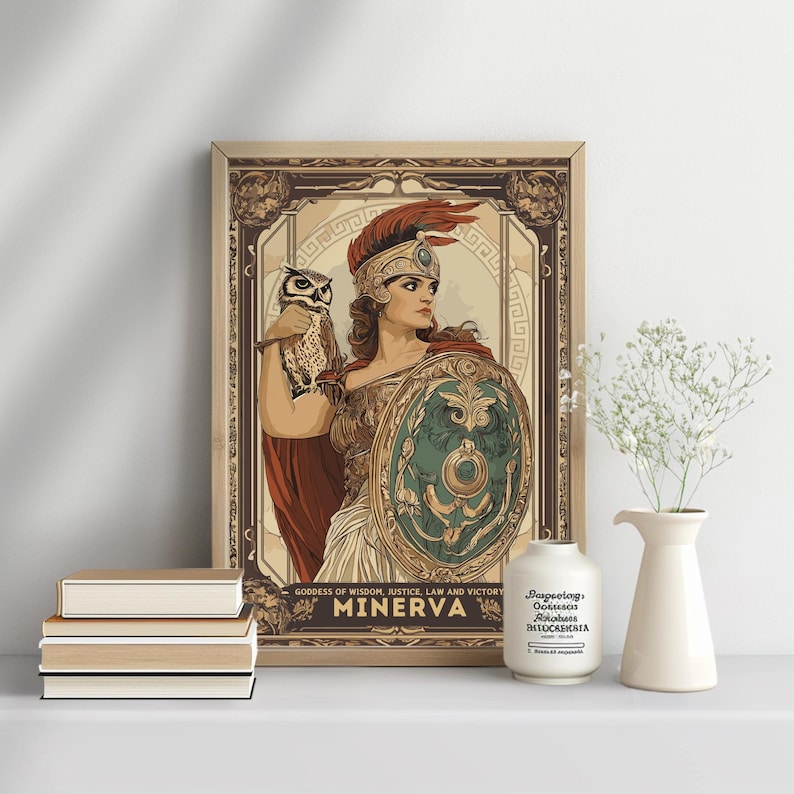 May include: Framed art print featuring Minerva, the Roman goddess of wisdom, holding a shield and an owl. The artwork has a vintage style with a beige border and the text "MINERVA" at the bottom. The print is displayed with books and a vase.