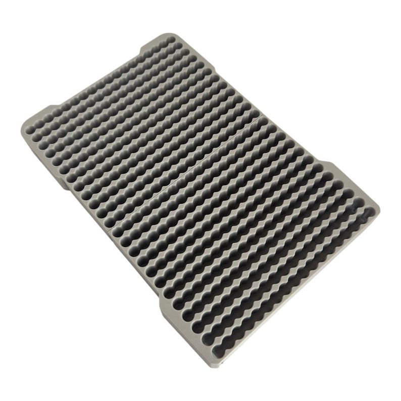 May include: A gray plastic tray with a honeycomb pattern. The tray has many small, round indentations.
