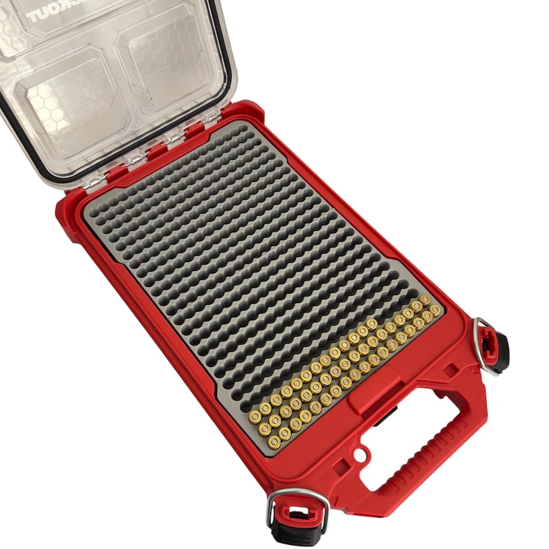 May include: Red ammo box with a clear lid, open to reveal a gray foam insert with rows of gold-colored bullets.