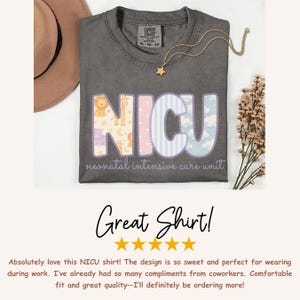 May include: A gray Comfort Colors t-shirt with the word "NICU" in pastel colors and animal patterns. The text "neonatal intensive care unit" is below the word. A gold necklace with a star pendant is on the shirt.