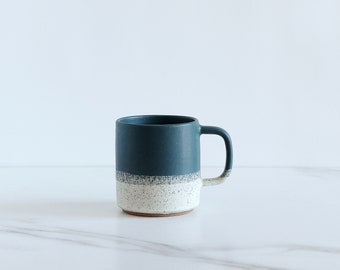 SAMPLE SALE : 12 oz mug. Speckled clay, glazed in Dark Teal + Cream.