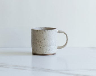 SECONDS SALE : 10 oz mug. Speckled clay, glazed in Sand.