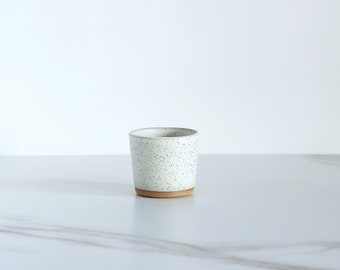 Espresso cup. Speckled clay, glazed in Cream.