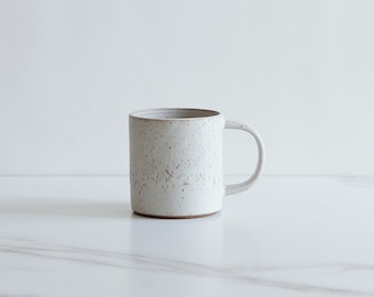 SECONDS SALE : 10 oz mug. Speckled clay, glazed in a warm white.