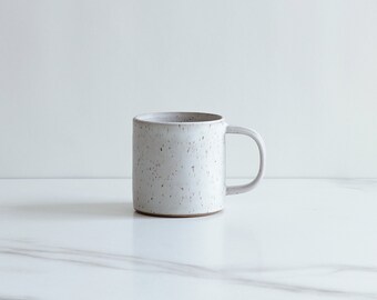 SAMPLE SALE : 10 oz mug. Speckled clay, glazed in a cool white.