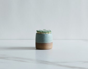 Match striker. Speckled clay, glazed in Mint.