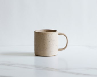 SECONDS SALE : 10 oz mug. Speckled clay, glazed in Dune.