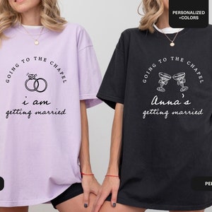 May include: Two black and purple t-shirts with the text "Going to the Chapel" and a wedding-themed graphic. The purple shirt says "I am getting married" and features a ring design. The black shirt says "Anna's getting married" and features a champagne glass design.