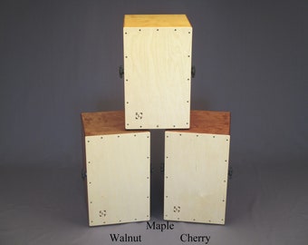 Handcrafted Cajon (Drum Box). The large (adult) size with adjustable snare, the small (child) size with fixed snare. Baltic Birch hardwood.
