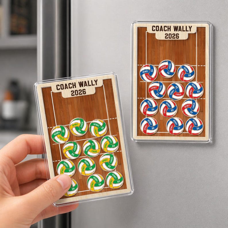 May include: Two rectangular magnets with a volleyball theme. One magnet is held by a hand. Each magnet features a volleyball court design with the text "COACH WALLY 2026". The magnets display volleyballs in green, yellow, red, and blue.
