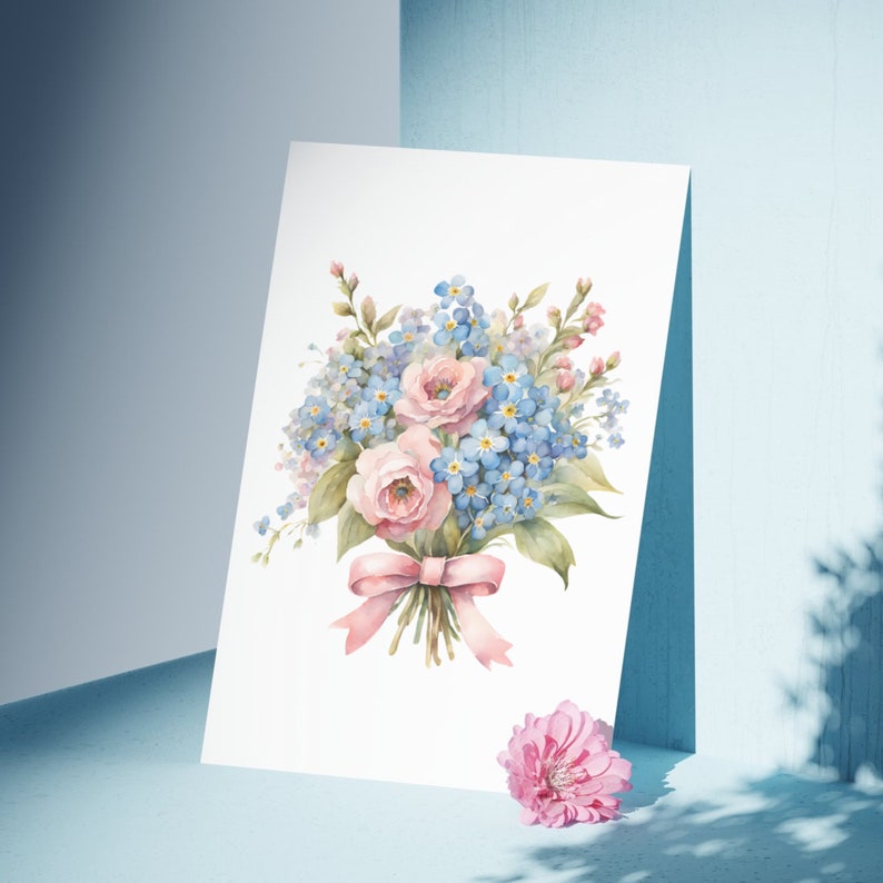 May include: A watercolor painting of a bouquet of pink and blue flowers tied with a pink ribbon. The flowers are arranged in a vase and the background is white.