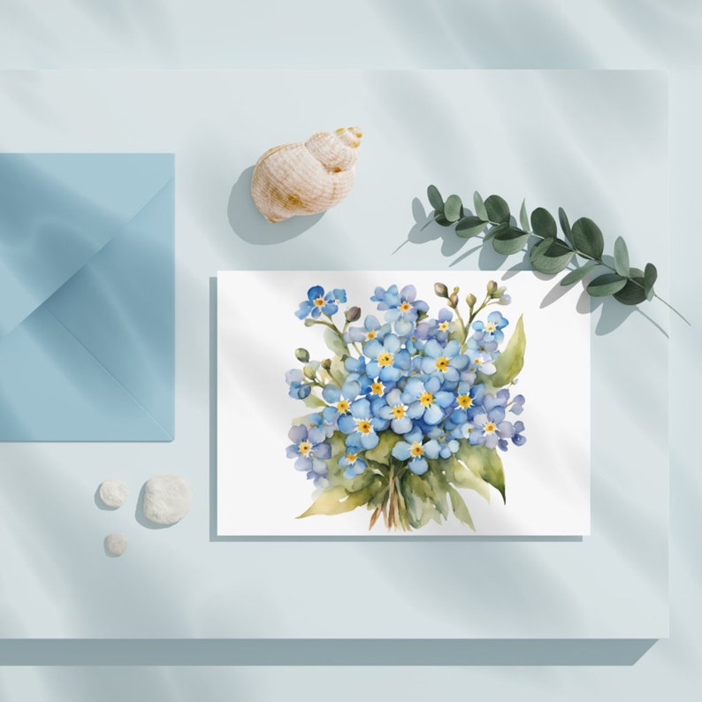 May include: A watercolor painting of a bouquet of forget-me-not flowers with blue petals and yellow centers. The flowers are arranged in a loose, natural style and are surrounded by green leaves.