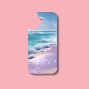 May include: A phone case featuring a beach scene with turquoise waves, a light purple sandy shore, and a blue sky with clouds. The case has a cutout at the top. The background is a solid pink color.