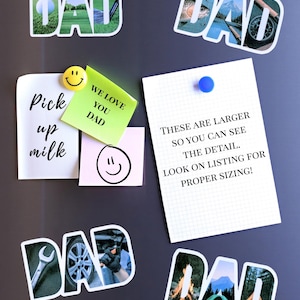 May include: Four refrigerator magnets with the word "DAD" spelled out in large letters. Each letter is made up of a different photo collage. The photos include a golf course, a fishing scene, a car mechanic, and a camping scene. The magnets are on a black refrigerator with a white note that says "These are larger so you can see the detail. Look on listing for proper sizing!" and a yellow sticky note that says "We love you Dad."