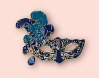 Marquerade enamel pin