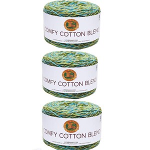 May include: Three skeins of Lion Brand Comfy Cotton Blend yarn in a green and blue colorway. The yarn is a blend of cotton and acrylic.