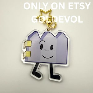 May include: A set of three ceramic mugs with a speckled, matte finish. The mugs are in shades of cream, light gray, and dark gray. Each mug has a simple, minimalist design and a rounded handle.