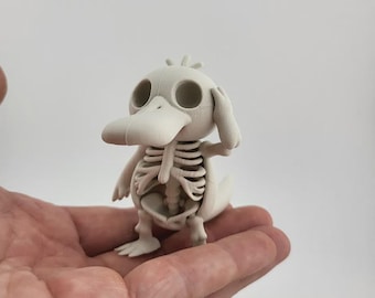 Figura estilizada de esqueleto de Psyduck (fan art de Pokémon)