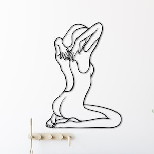 nude woman line art,
metal wall decor,
aesthetic design,
minimalist line art,
nude female wall art,
home and living,
one line art,
naked women decor,
confident woman art,
naked woman body,
above bed decor,
christmas gift,
gift for her,