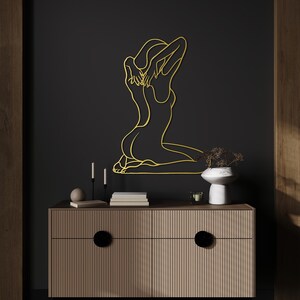 nude woman line art,
metal wall decor,
aesthetic design,
minimalist line art,
nude female wall art,
home and living,
one line art,
naked women decor,
confident woman art,
naked woman body,
above bed decor,
christmas gift,
gift for her,