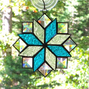 Stained Glass Quilt Suncatcher in the 8 Point Star Pattern with Clear and Aqua Blue Textured Glass, and Clear Bevels