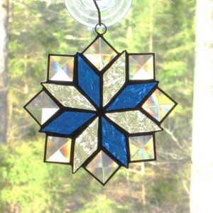 Stained Glass Quilt Suncatcher in the 8 Point Star Quilt Pattern with Clear and Medium Blue Textured Glass, and Clear Bevels
