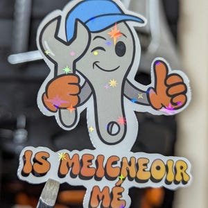 mechanic sticker of a spanner character in a baseball cap, holding a spanner giving a thumbs up and winking.
