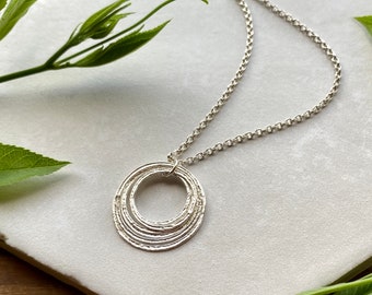 7 Circle 70th Minimalist Milestone Birthday Necklace, Sterling Silver 7 Rings Seven Decades Handcrafted Perfectly Imperfect Circle Pendant